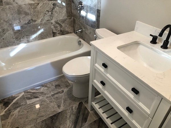 131 Congress Avenue, Unit 2 Chelsea, MA 02150 - Photo 22 of 30 a bathroom with a sink a toilet and bathtub