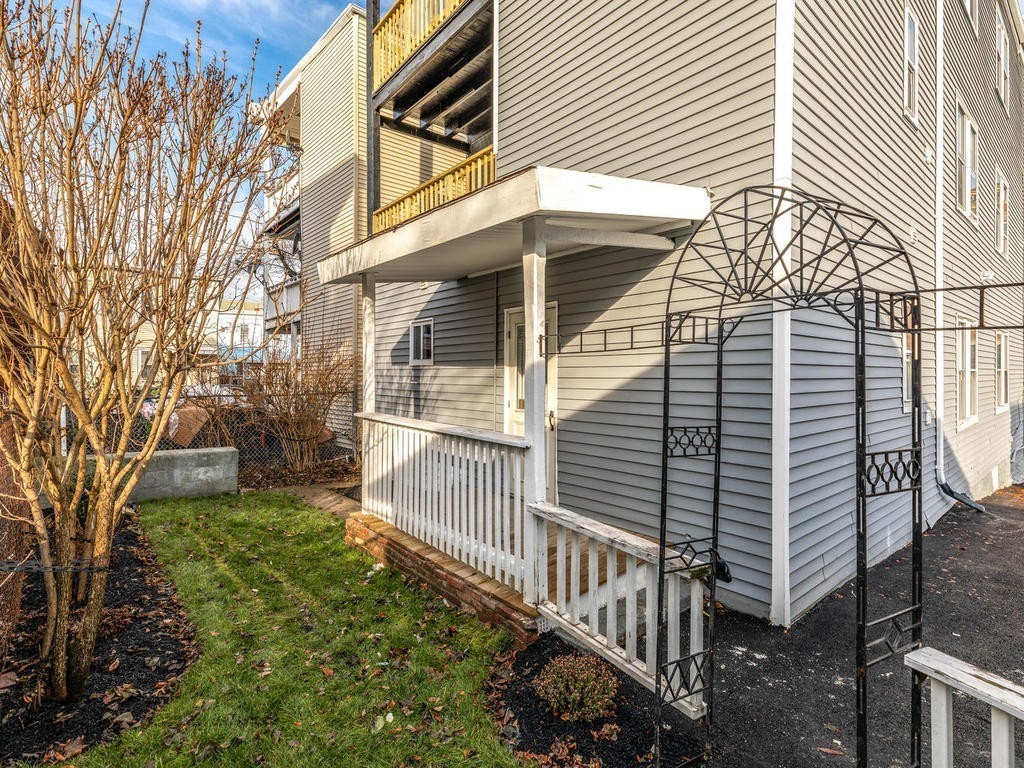 131 Congress Avenue, Unit 2 Chelsea, MA 02150 - Photo 26 of 30 a view of a house with a yard and porch