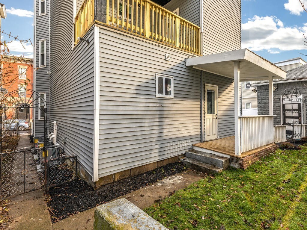 131 Congress Avenue, Unit 2 Chelsea, MA 02150 - Photo 27 of 30 a view of a small house with roof and wooden walls