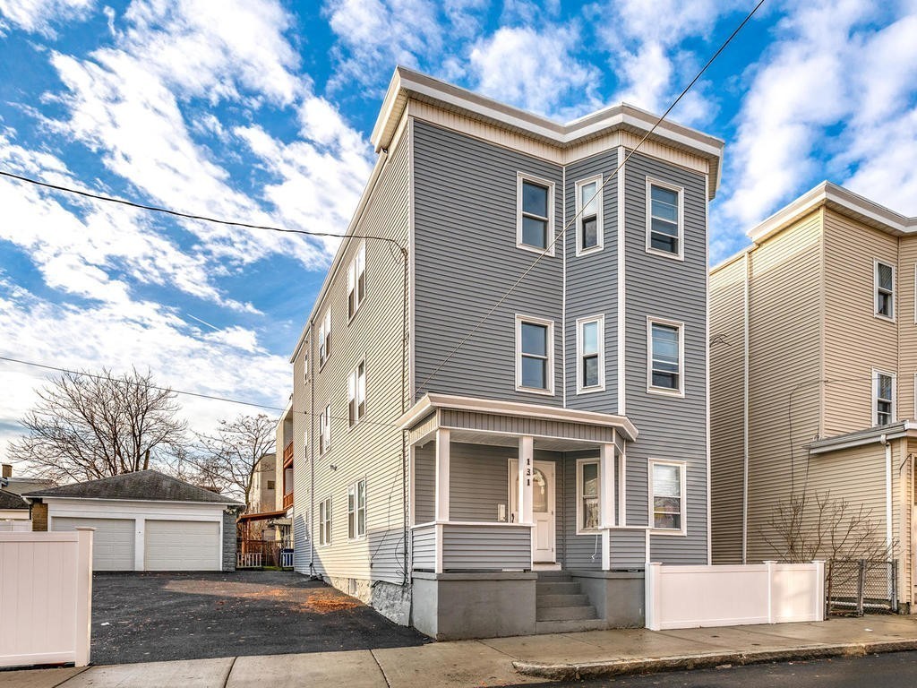 131 Congress Avenue, Unit 2 Chelsea, MA 02150 - Photo 3 of 30 a front view of a house with a yard