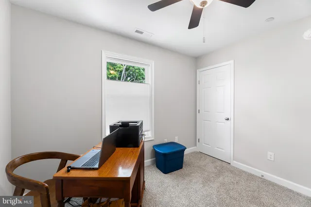 a view of a workspace with furniture