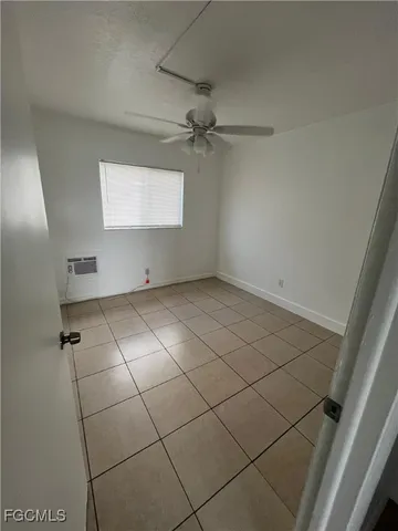 a view of empty room with windows