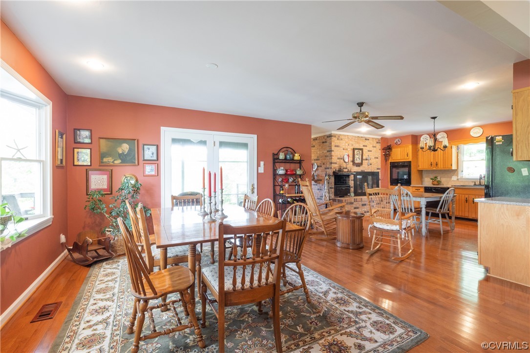 213 Greenvale Creek Road Lancaster, VA 22503 - Photo 14 of 50 a view of a dining room with furniture window and outside view