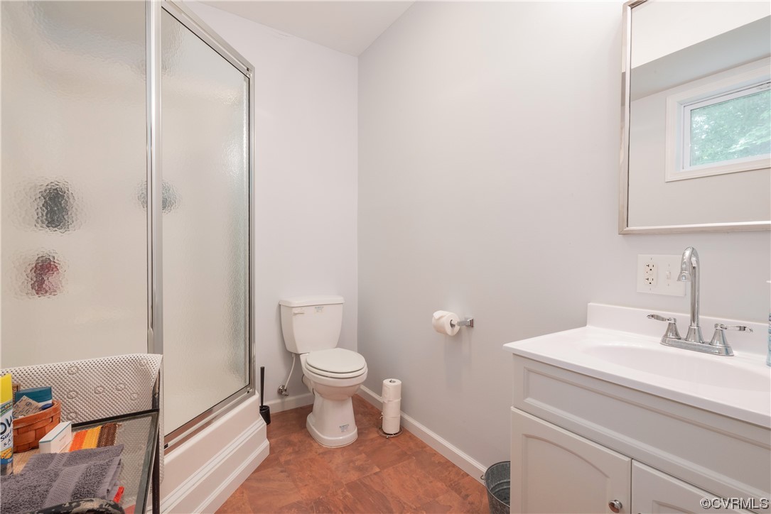 213 Greenvale Creek Road Lancaster, VA 22503 - Photo 27 of 50 a bathroom with a sink toilet and shower
