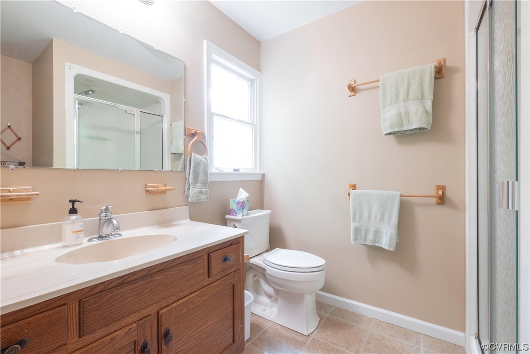 213 Greenvale Creek Road Lancaster, VA 22503 - Photo 32 of 50 a bathroom with a sink toilet and mirror