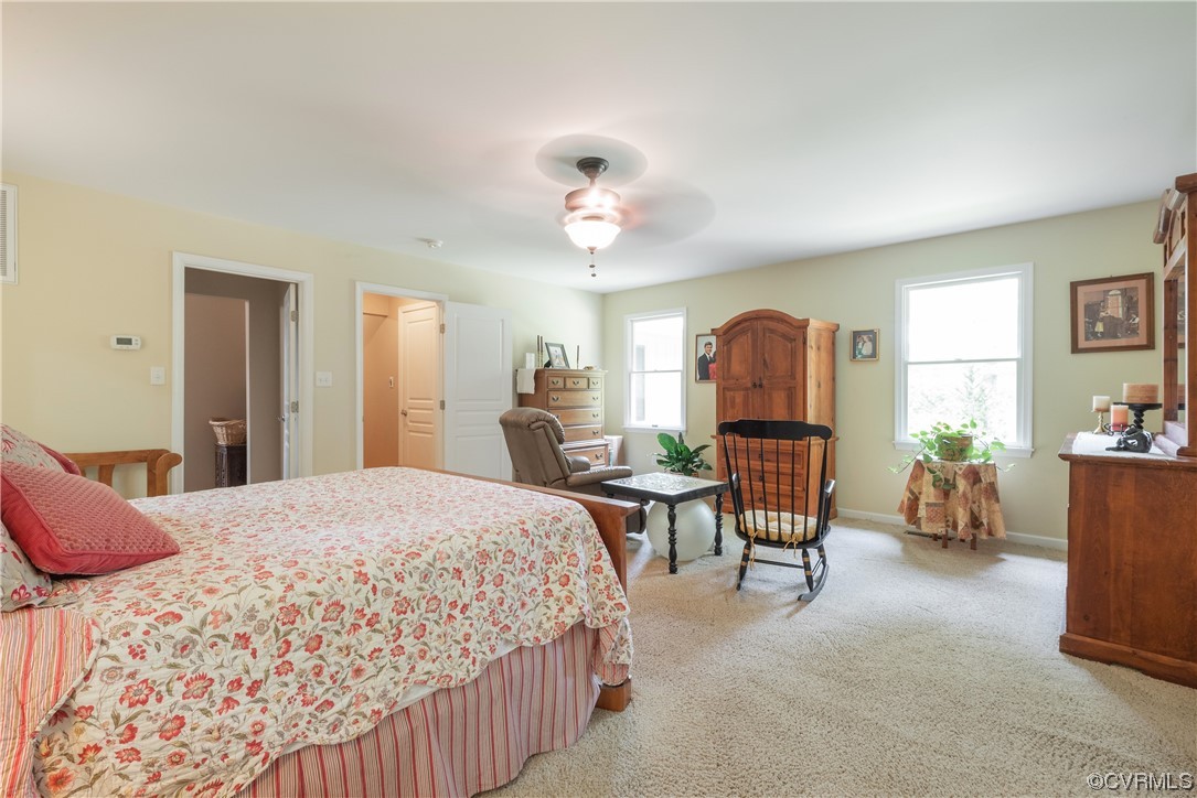 213 Greenvale Creek Road Lancaster, VA 22503 - Photo 33 of 50 a bedroom with a bed and furniture
