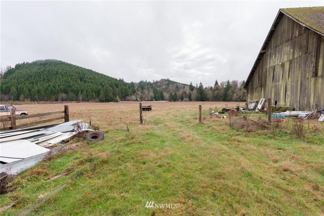 168 Katula Road Chehalis, WA 98532 - Photo 12 of 40 a view of a lake with a yard and mountain view