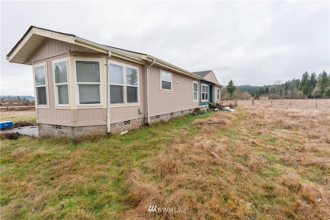 168 Katula Road Chehalis, WA 98532 - Photo 8 of 40 a view of an house with backyard space and balcony