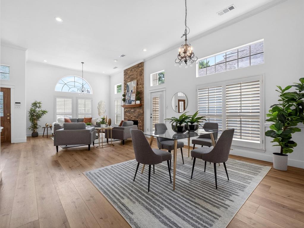 4345 Timberglen Road Dallas, TX 75287 - Photo 6 of 26 a living room with furniture and a chandelier