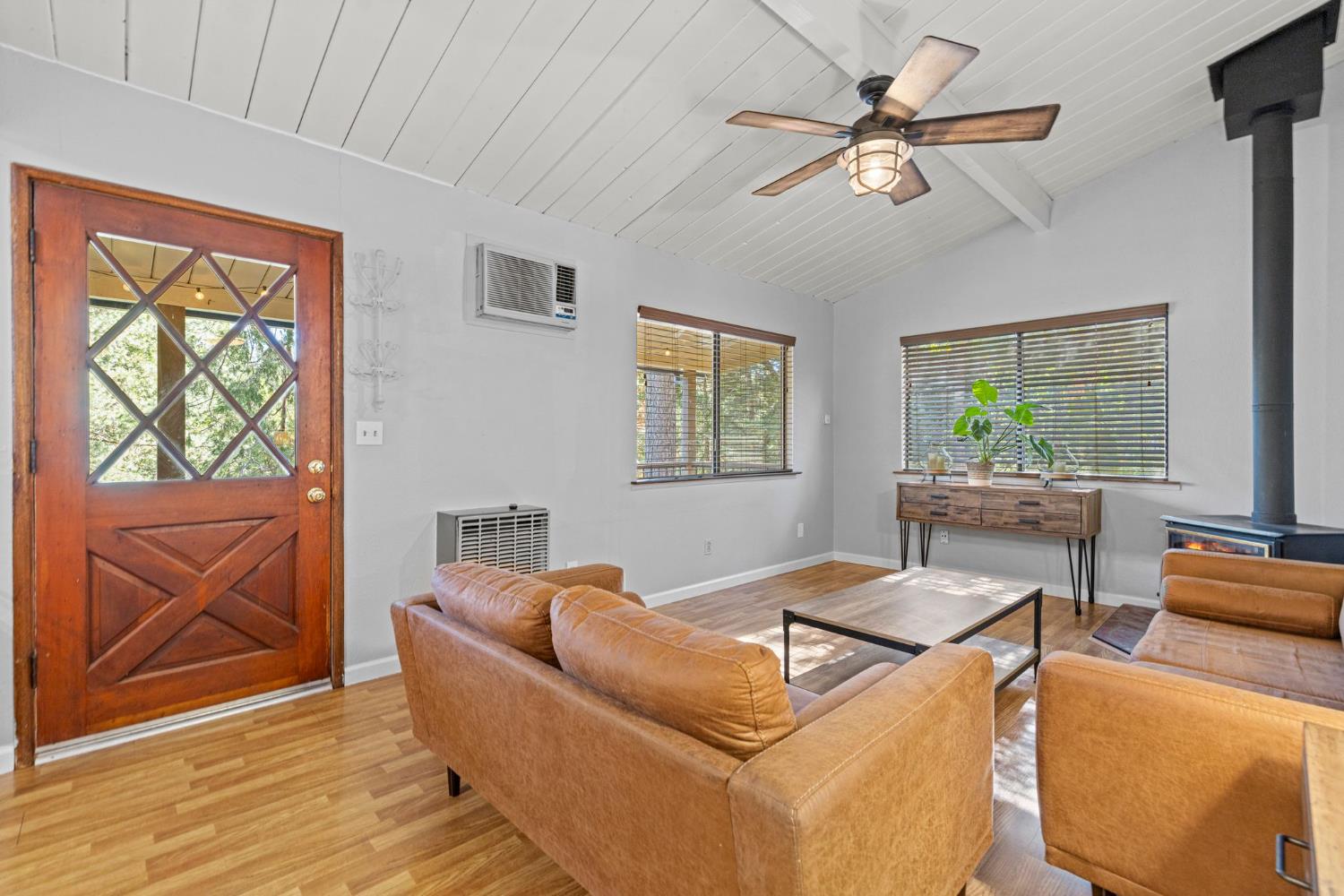3220 Naomi Way Placerville, CA 95667 - Photo 12 of 57 a living room with furniture a window and a flat screen tv
