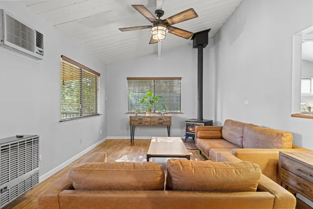 a bedroom with a bed and a night stand