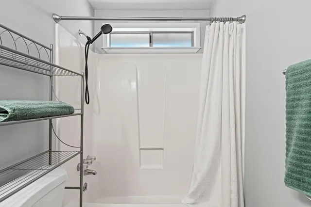 a en suite bathroom with a sink and a mirror