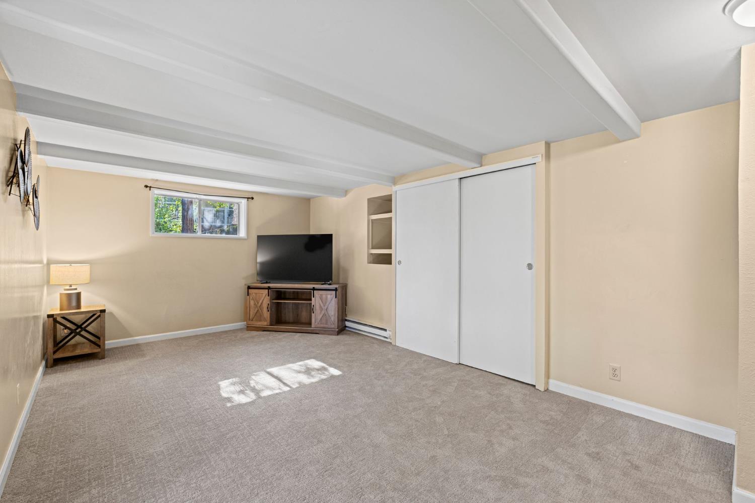 3220 Naomi Way Placerville, CA 95667 - Photo 27 of 57 a living room with furniture and a flat screen tv