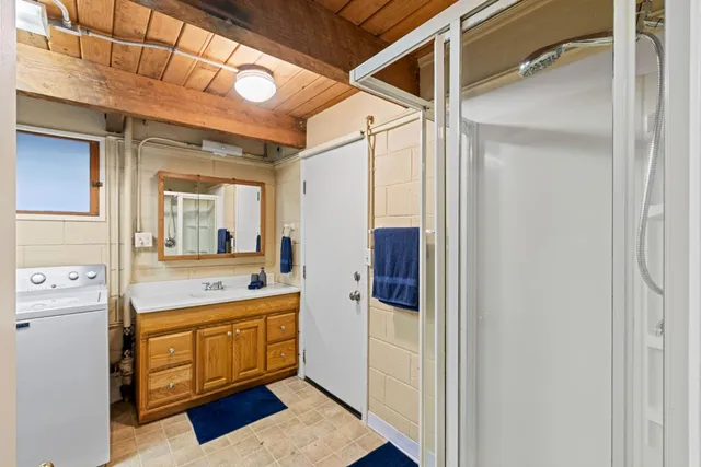 a view of balcony with wooden floor and fence