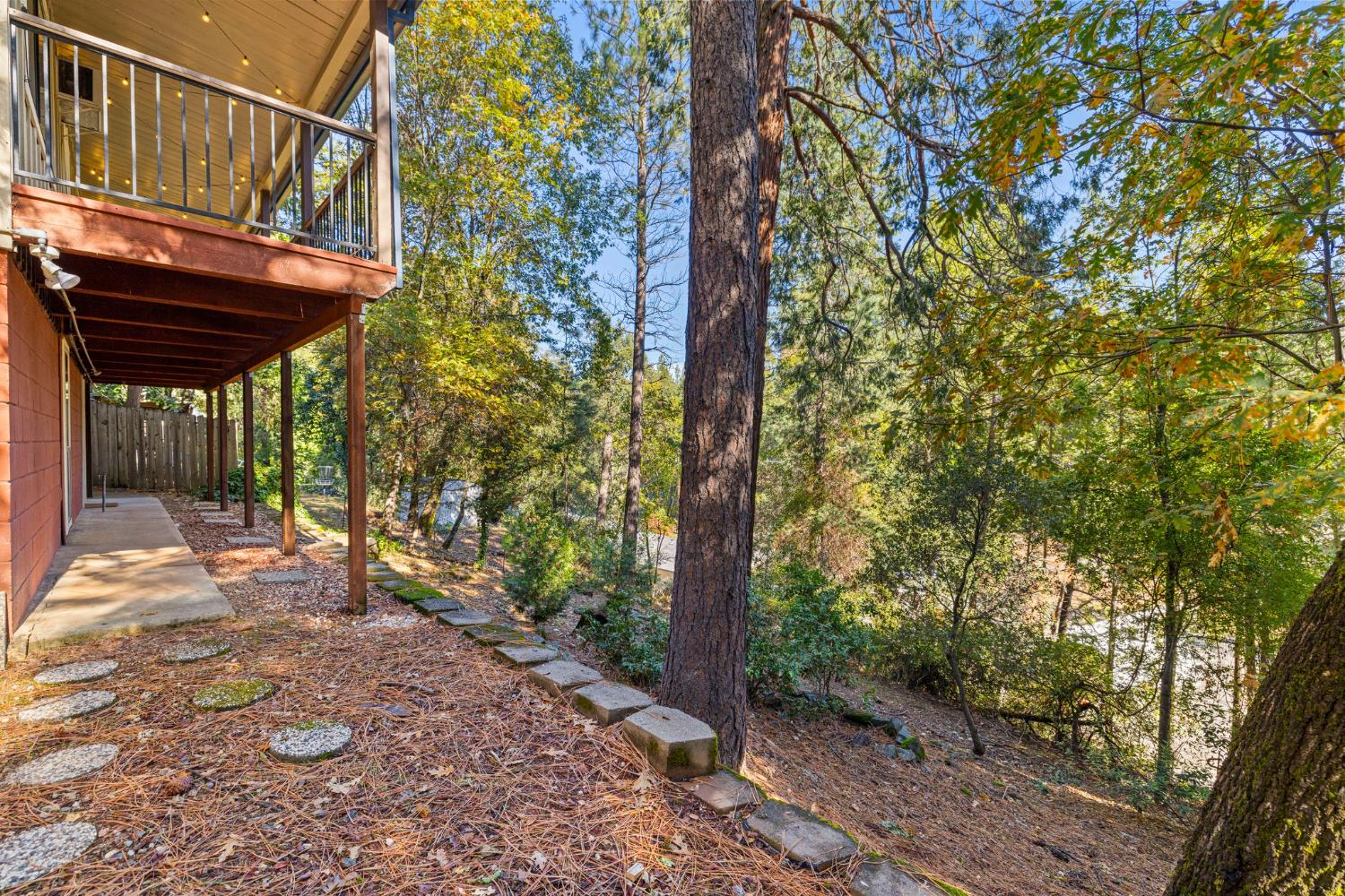3220 Naomi Way Placerville, CA 95667 - Photo 42 of 57 a view of a patio with table and chairs and a large tree