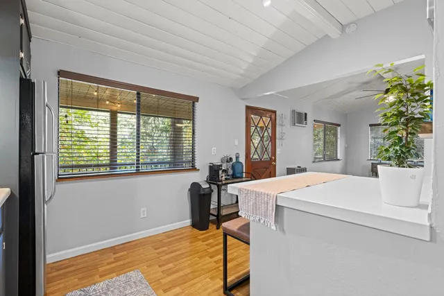 a kitchen with a refrigerator and a stove