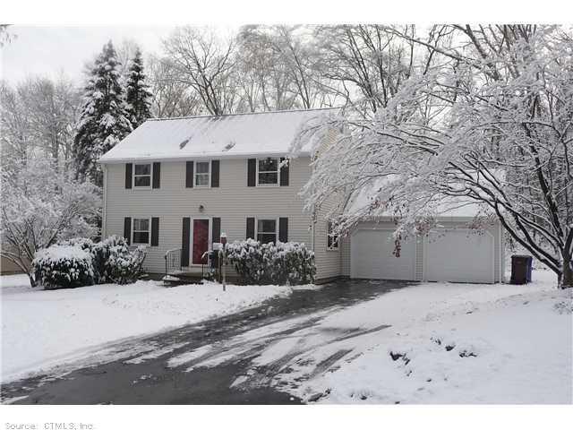 27 Silversmith Road Farmington, CT 06085 - Photo 1 of 1 a view of a white house with a yard covered in snow
