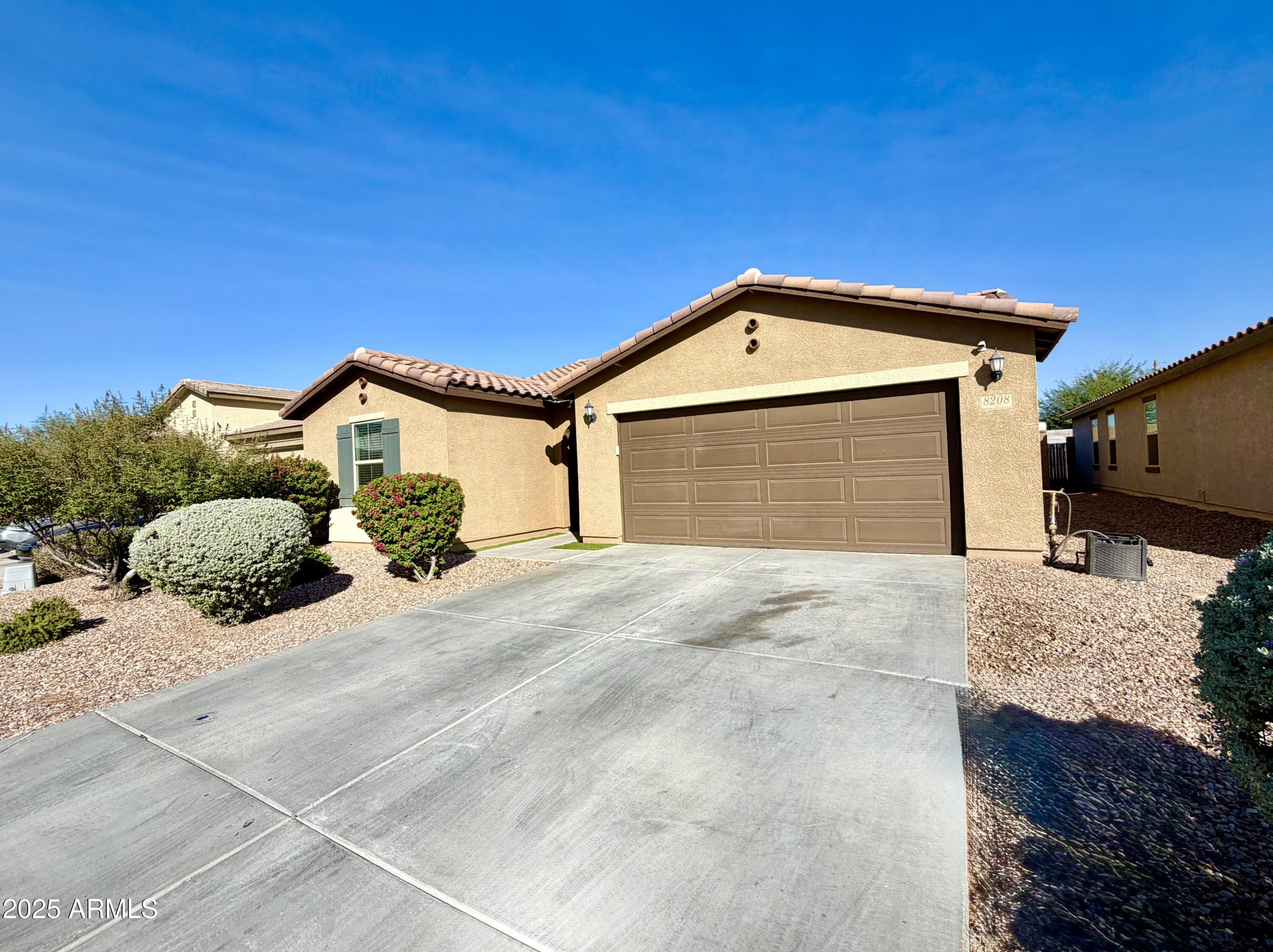 8208 West Sands Road Glendale, AZ 85303 - Photo 1 of 27 a front view of a house with a yard