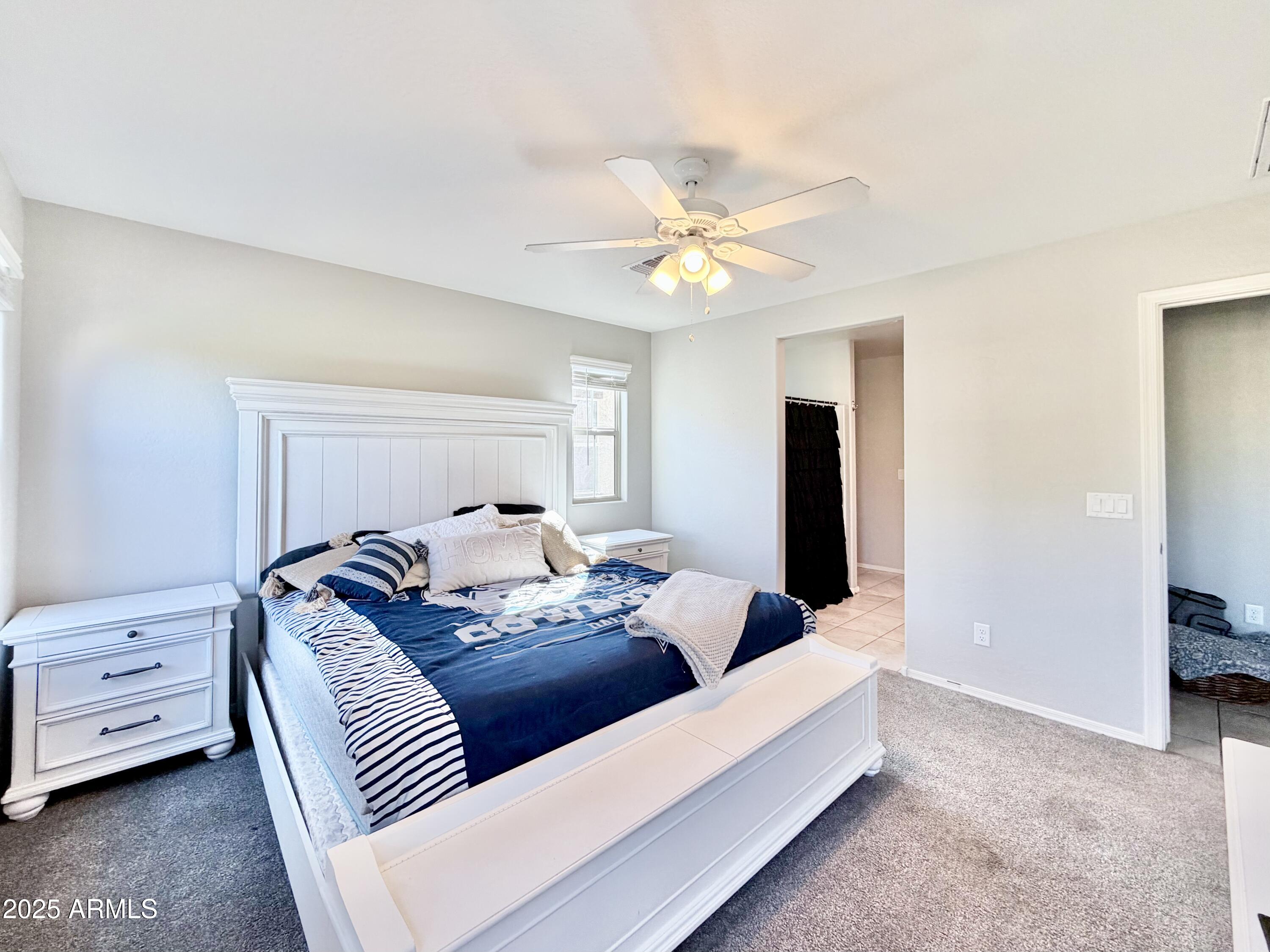 8208 West Sands Road Glendale, AZ 85303 - Photo 12 of 27 a living room with furniture and a ceiling fan