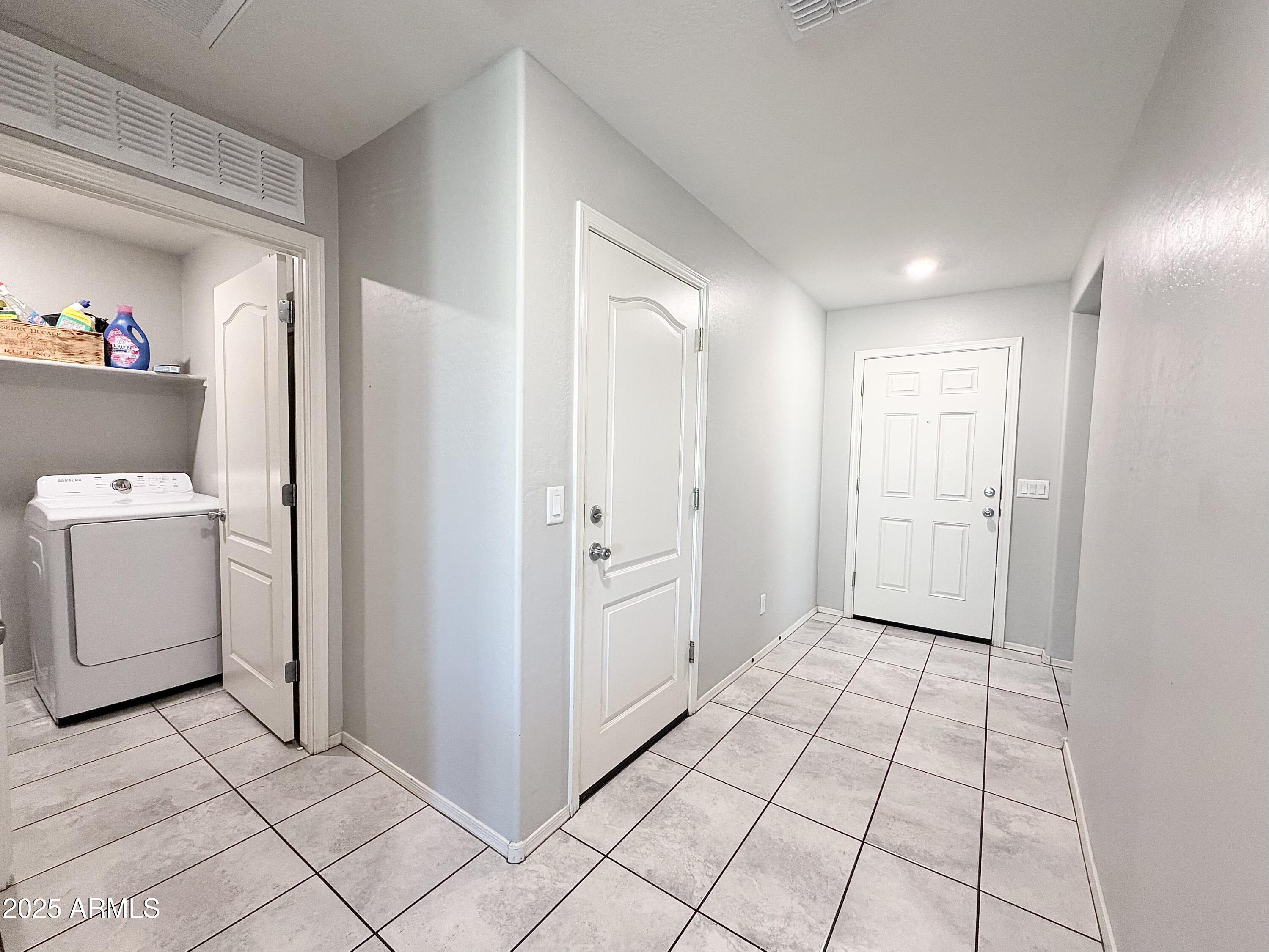 8208 West Sands Road Glendale, AZ 85303 - Photo 18 of 27 a view of a storage & utility room with washer and dryer