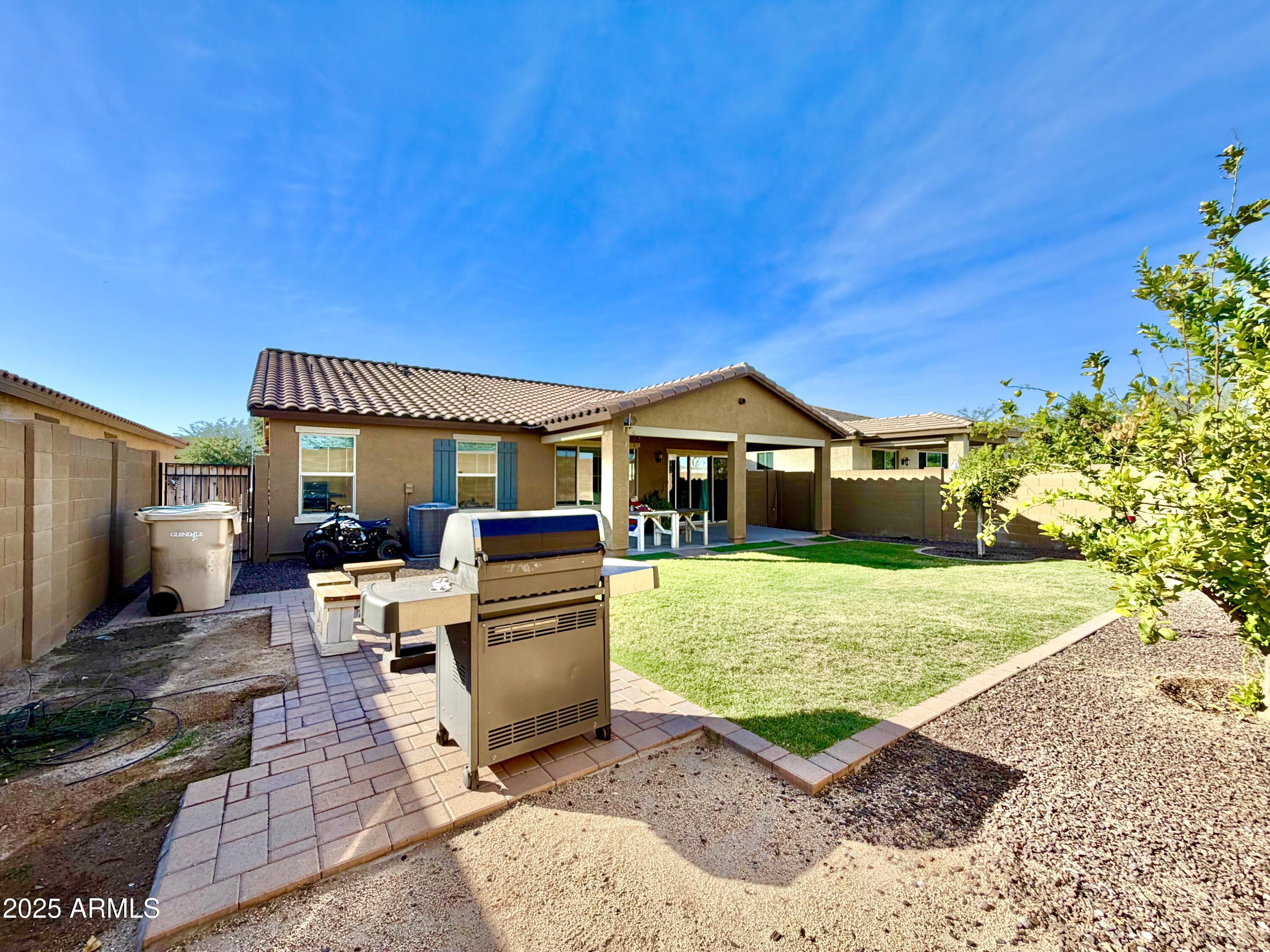 8208 West Sands Road Glendale, AZ 85303 - Photo 24 of 27 a front view of a house with garden