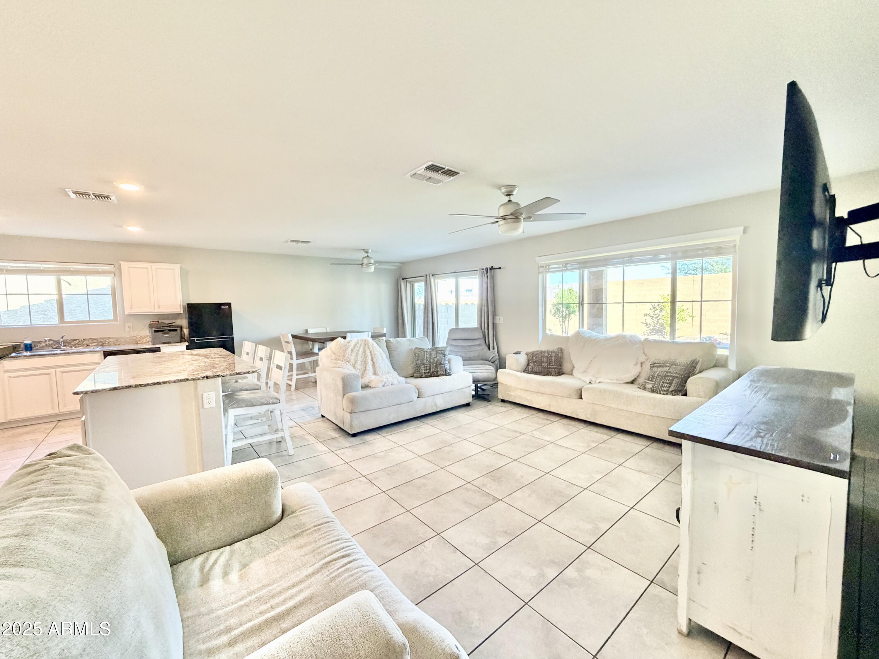 8208 West Sands Road Glendale, AZ 85303 - Photo 5 of 27 a living room with furniture and a window