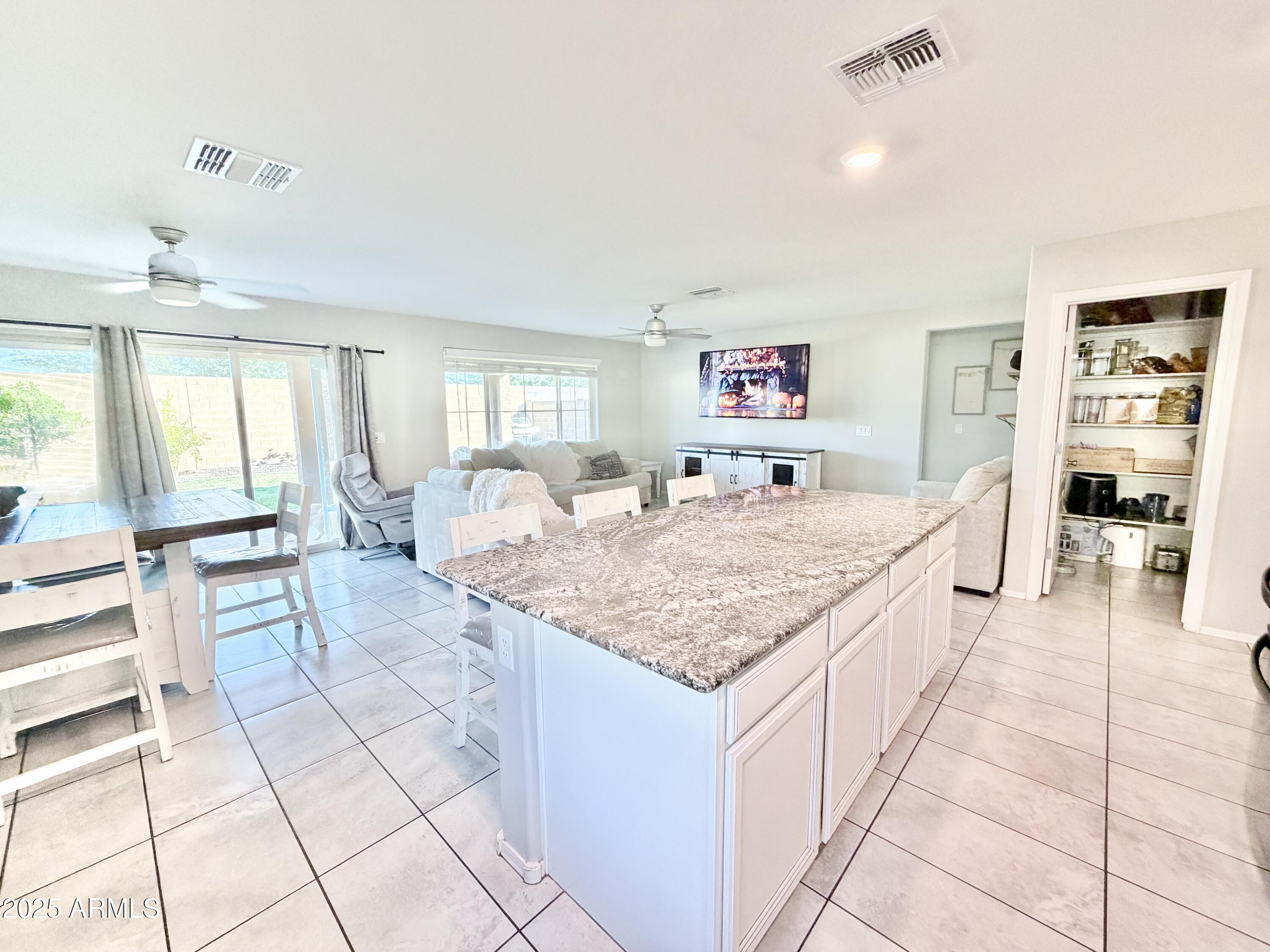 8208 West Sands Road Glendale, AZ 85303 - Photo 7 of 27 a living room with granite countertop furniture and a dining table