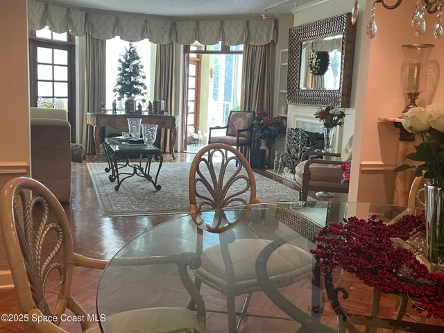 a kitchen with stainless steel appliances granite countertop a refrigerator a stove and a refrigerator with wooden floor