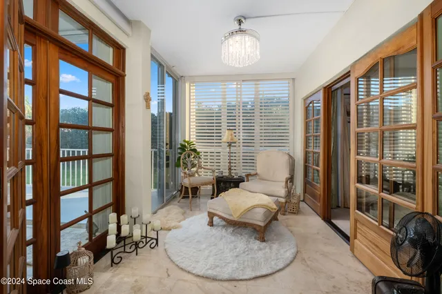 a view of a livingroom with furniture and a window