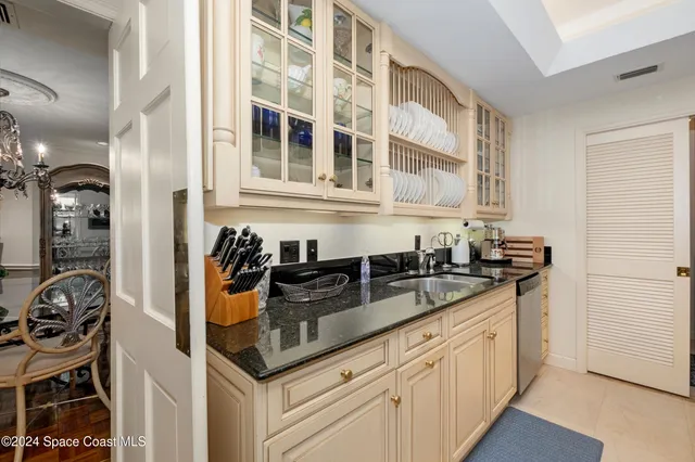 a kitchen with stainless steel appliances a refrigerator stove and microwave