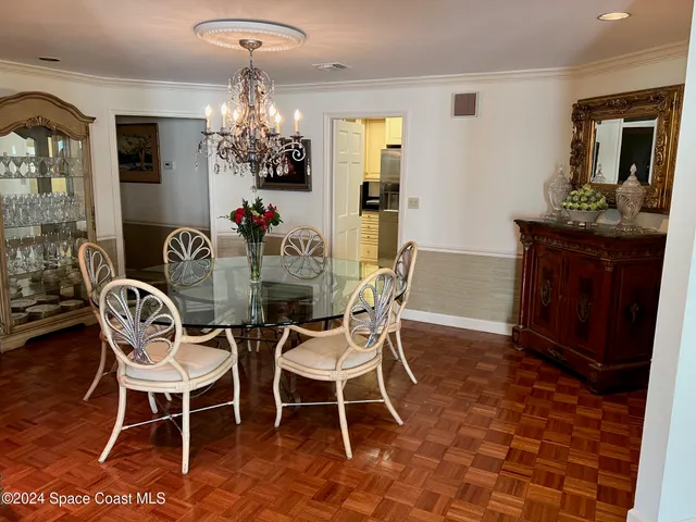 a dining room with furniture and a window