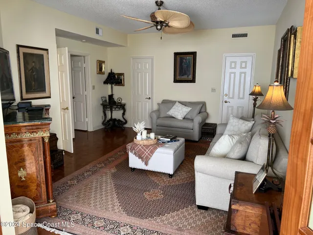 a bedroom with a bed and a television