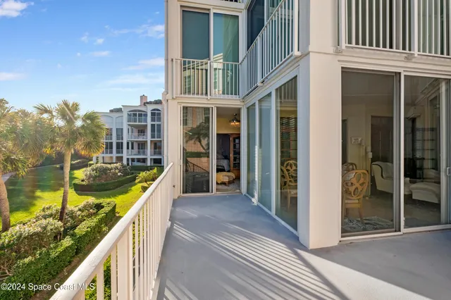 an aerial view of a house with a ocean view