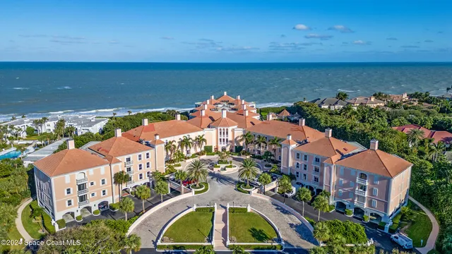 a view of white house with a yard