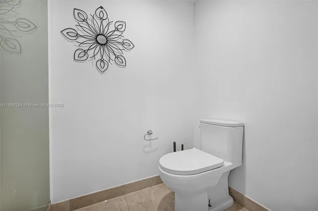 a bathroom with a toilet and a sink