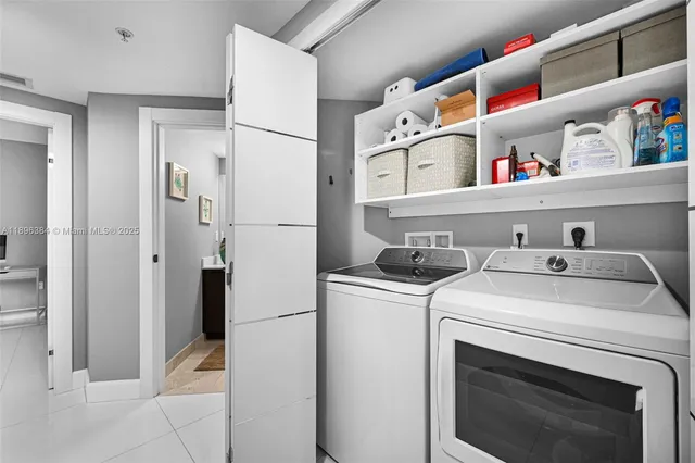 a utility room with dryer and washer