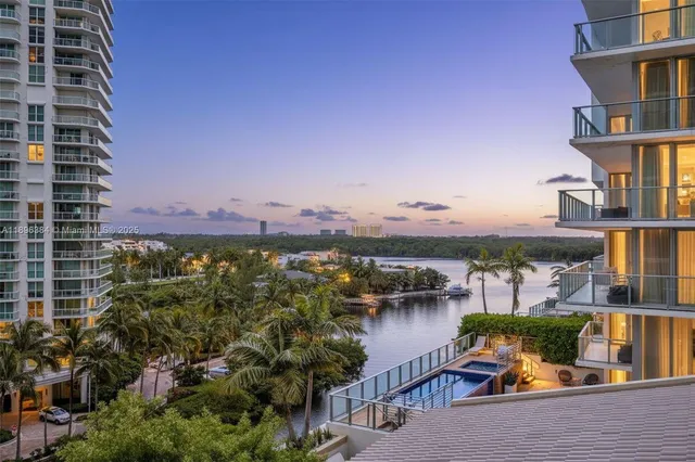an aerial view of a house with a lake view