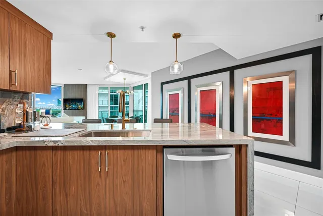 a kitchen with stainless steel appliances granite countertop a sink and a cabinets