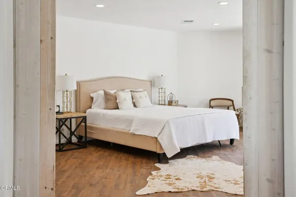 a bedroom with bed and a window