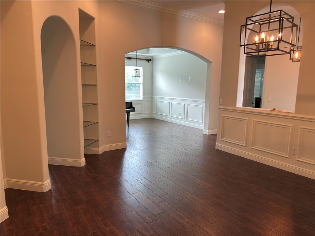 4253 Diamond Square Vero Beach, FL 32967 - Photo 11 of 22 an empty room with wooden floor and windows
