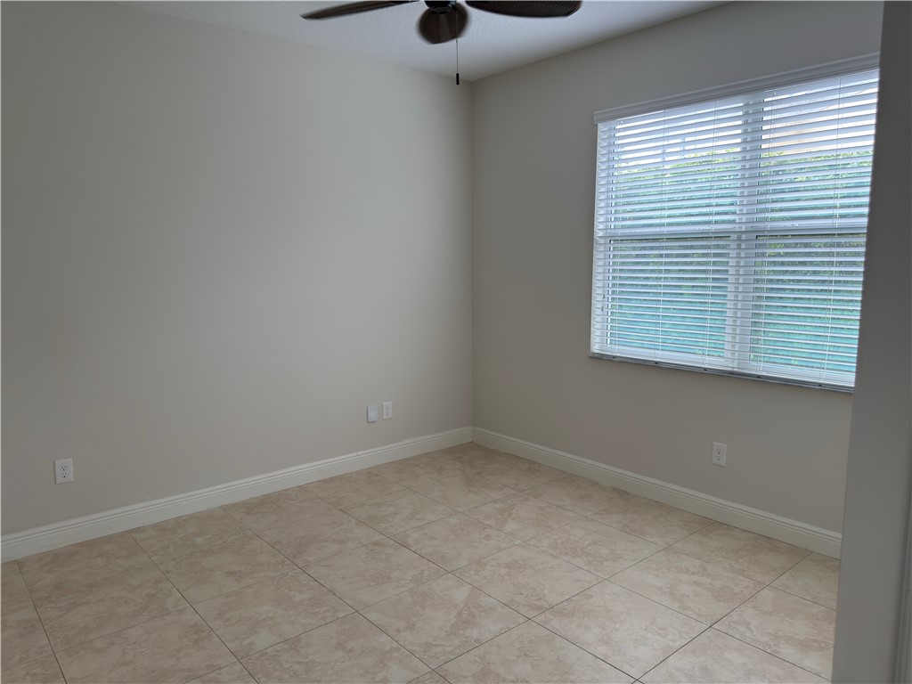 4253 Diamond Square Vero Beach, FL 32967 - Photo 17 of 22 an empty room with windows