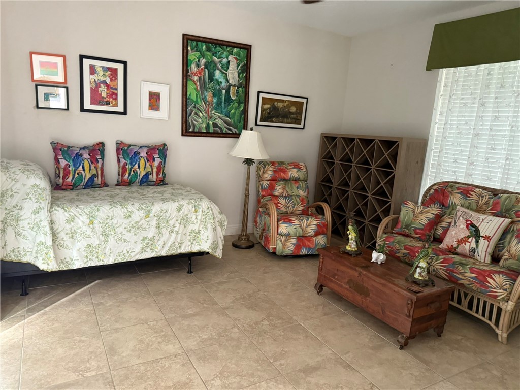 4253 Diamond Square Vero Beach, FL 32967 - Photo 19 of 22 a bedroom with a bed and a couch
