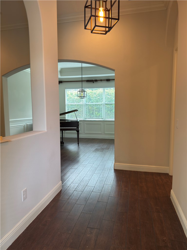 4253 Diamond Square Vero Beach, FL 32967 - Photo 2 of 22 an empty room with wooden floor table and windows