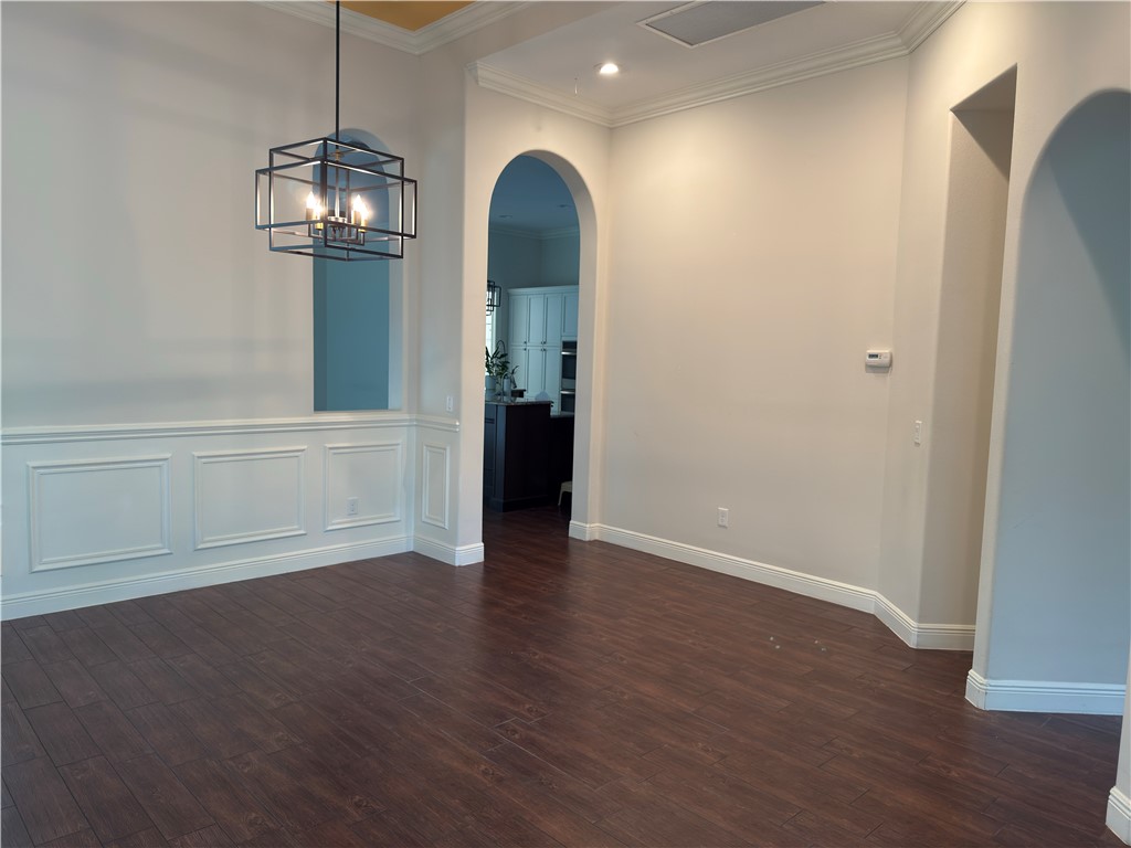 4253 Diamond Square Vero Beach, FL 32967 - Photo 3 of 22 a view of empty room with wooden floor and window