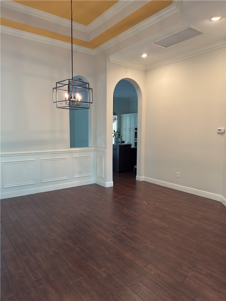4253 Diamond Square Vero Beach, FL 32967 - Photo 4 of 22 a view of empty room with wooden floor and stove