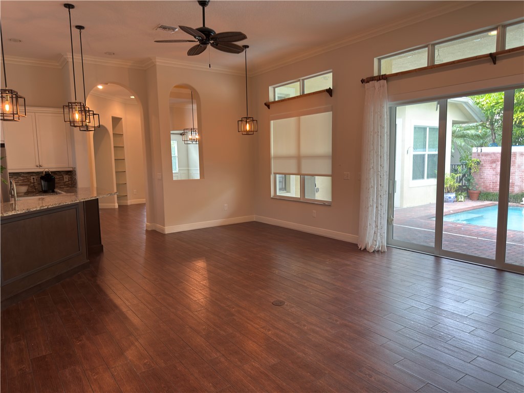 4253 Diamond Square Vero Beach, FL 32967 - Photo 10 of 22 a view of a kitchen with wooden floor and a window