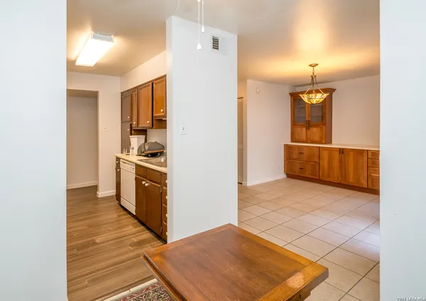 a kitchen with stainless steel appliances a sink a stove and a refrigerator