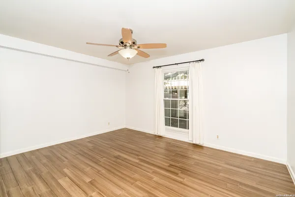 a view of a livingroom with wooden floor