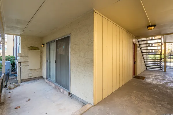 a front view of a house with a garden and plants