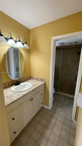 a bathroom with a shower and a toilet